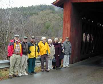 At the Station Bridge in Northfield - W.
McKone, J. Weaver, R. Moore, R. Bechard, M. Converse, R. Nelson, K. Ramsey, F. Converse. 
Photo by
Joe Nelson, Nov. 00